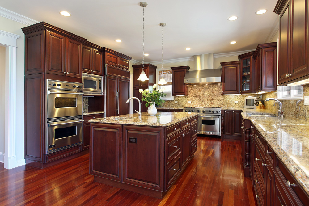 Kitchen with central island with pendant lights in Glendale CO